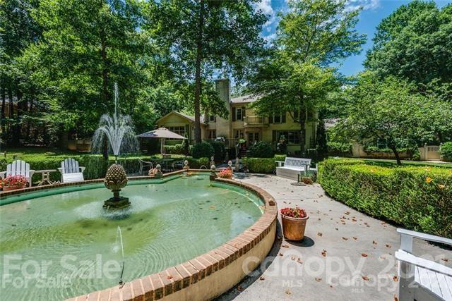 2932 High Ridge Road Charlotte, NC 28270 - Photo 24 of 26 a swimming pool with outdoor seating and garden