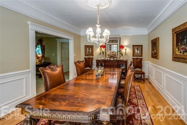 2932 High Ridge Road Charlotte, NC 28270 - Photo 5 of 26 a living room with dining table and a chandelier