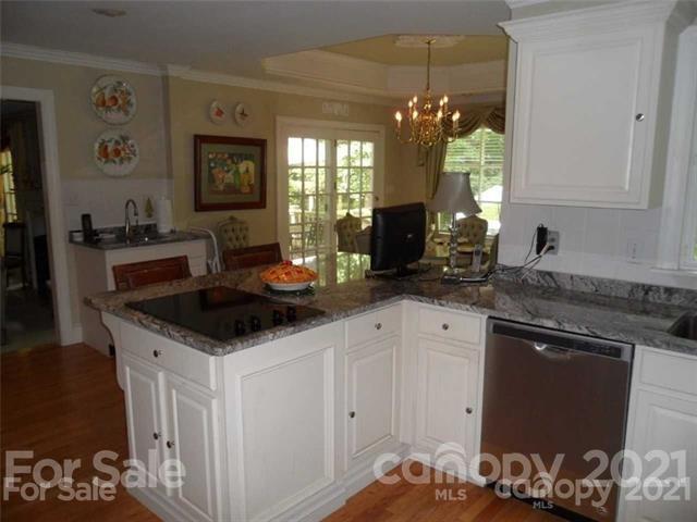 2932 High Ridge Road Charlotte, NC 28270 - Photo 9 of 26 a kitchen with a sink and cabinets