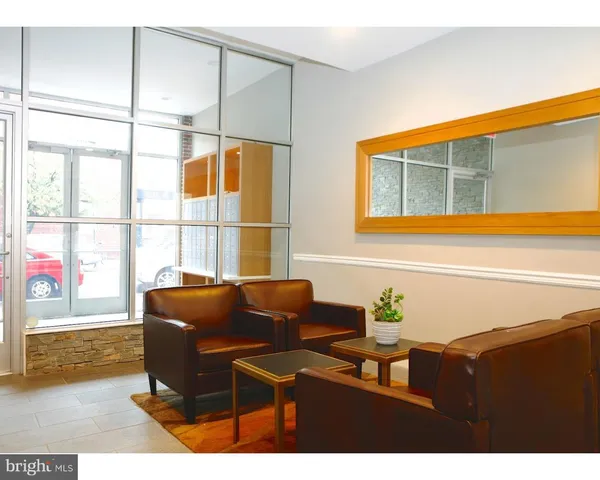 a view of a living room and dining room with furniture