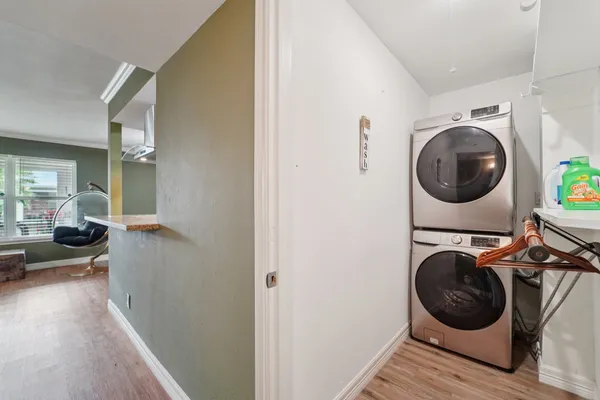 a view of a bedroom with washer and dryer