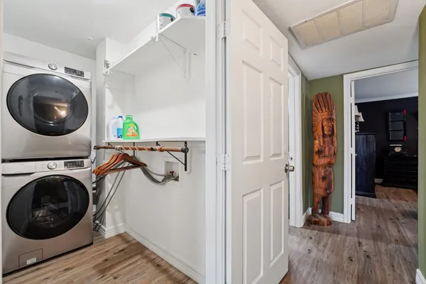 a utility room with sink dryer and washer
