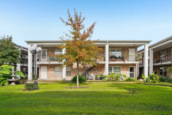 front view of a house with a garden