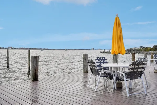 a view of a swimming pool and lounge chair