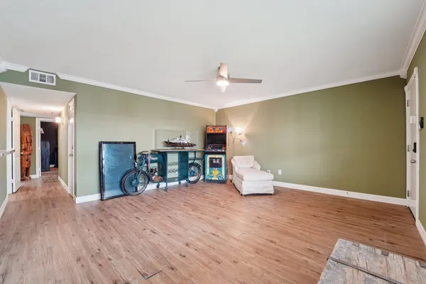 a view of a room with wooden floor