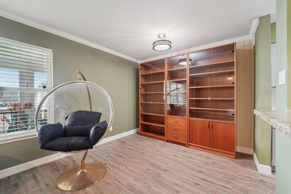 a view of furniture and wooden floor in a room