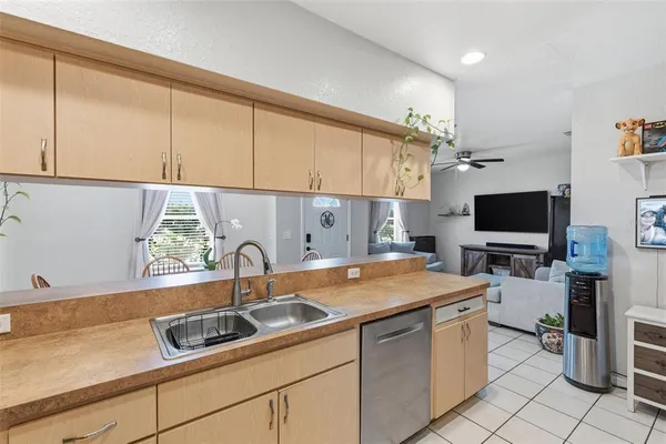 a kitchen with a sink cabinets and appliances