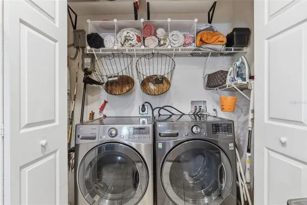 a utility room with dryer and washer