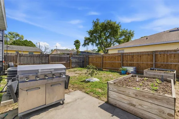 a view of a backyard with sitting area