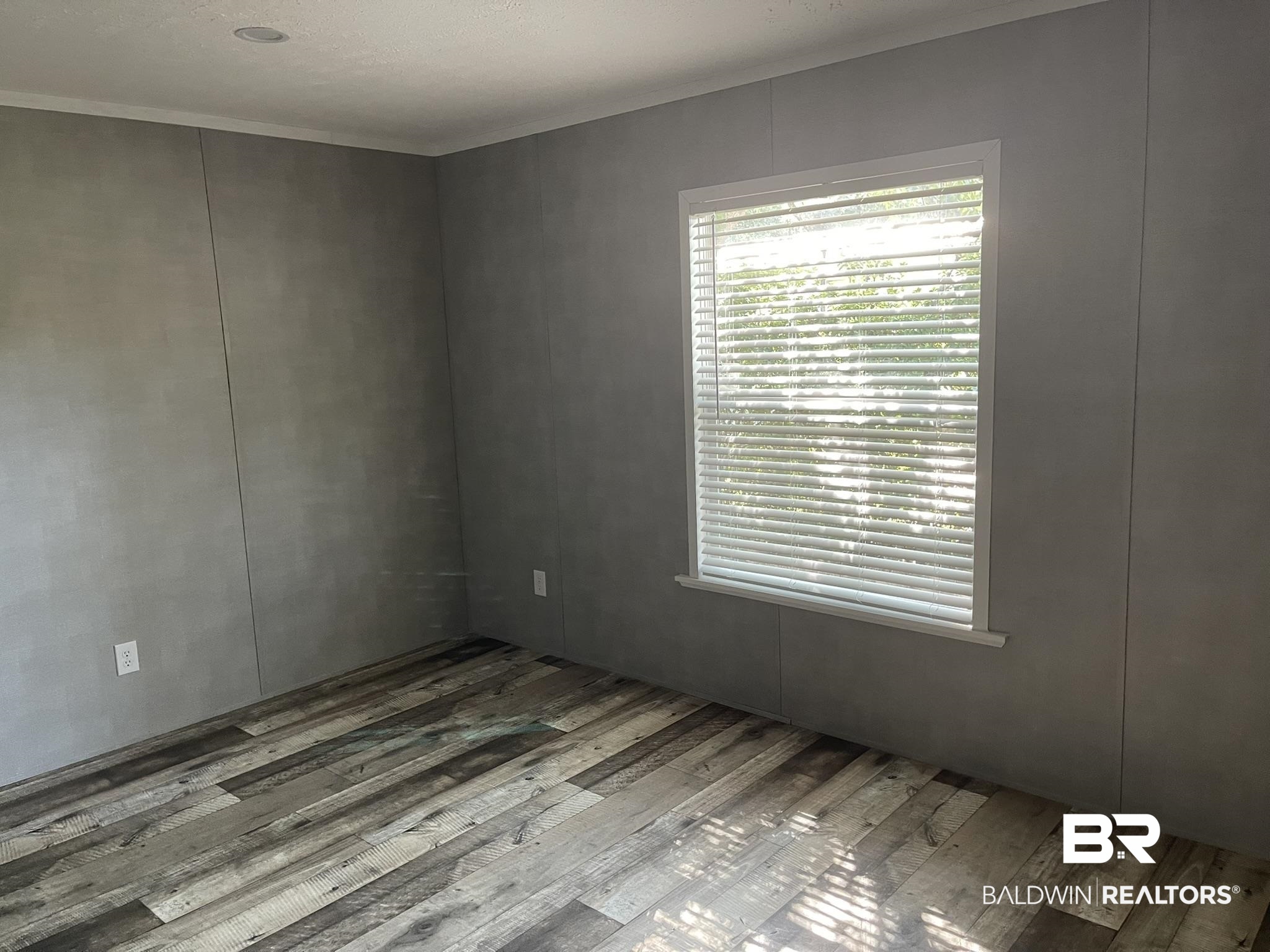 9592 Redfish Drive Elberta, AL 36530 - Photo 8 of 8 Unfurnished room with wood-type flooring