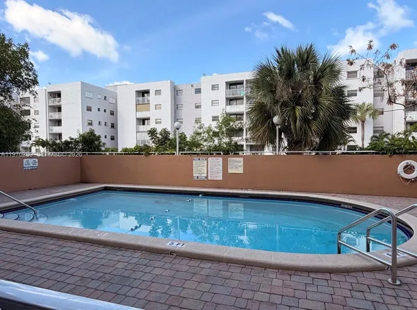a view of empty room with wooden floor and floor to ceiling window