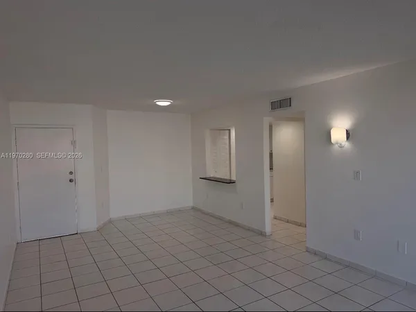 a view of an empty room and window