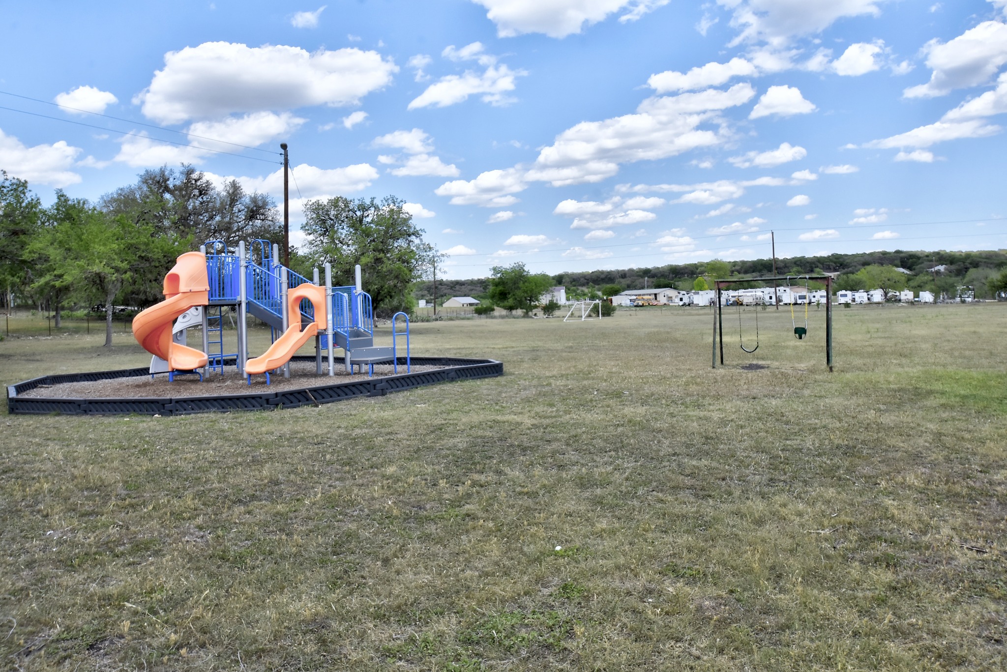 1170 Misty Lane Spring Branch, TX 78070 - Photo 23 of 24 A spacious community playground and swing set await, perfect for recreation and outdoor fun.