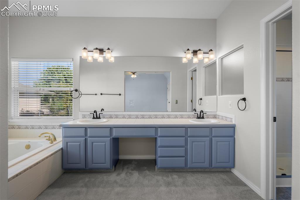 12336 Stanley Canyon Road Colorado Springs, CO 80921 - Photo 28 of 50 featuring double vanity