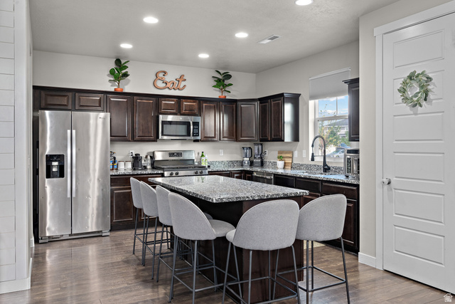 1074 South 750 West Springville, UT 84663 - Photo 9 of 28 Contemporary kitchen featuring dark wood cabinetry, granite countertops, and stainless steel appliances