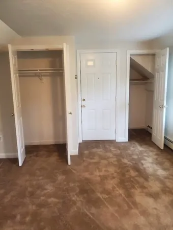 an empty room with closet area