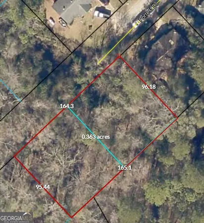 a view of a yard with a tree