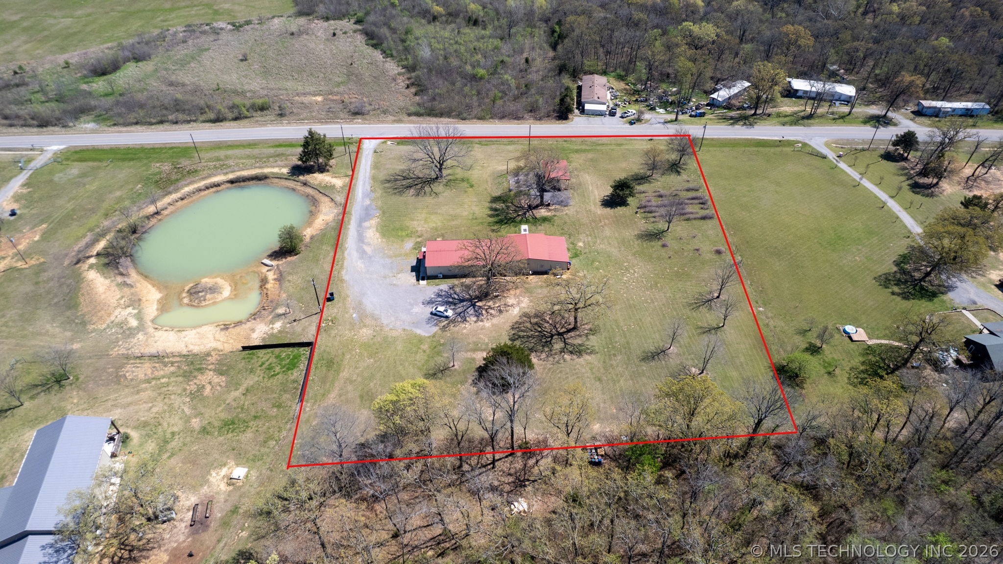 3565 Sawmill Road Caddo, OK 74729 - Photo 31 of 32 Expansive property featuring a private pond, open grassy areas, and mature trees