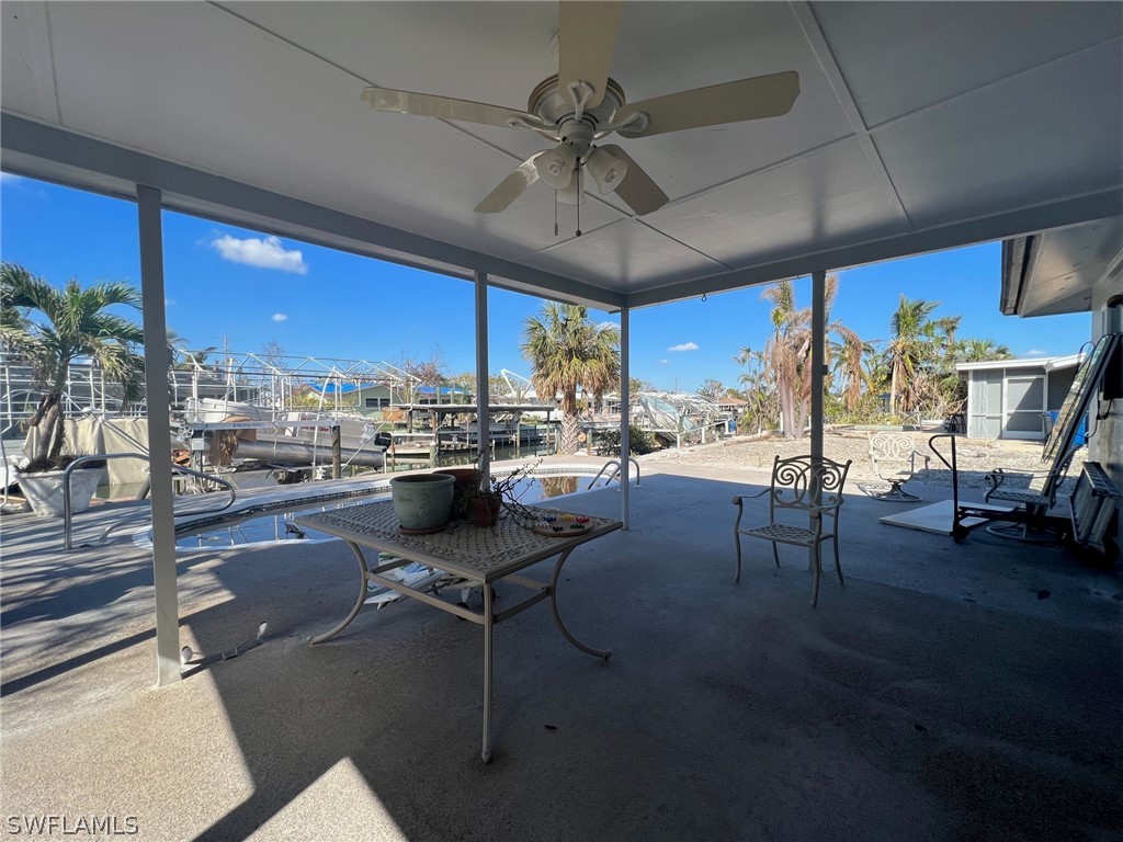 201 Randy Lane Fort Myers Beach, FL 33931 - Photo 4 of 7 a room with lots of table chair