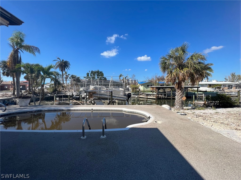 201 Randy Lane Fort Myers Beach, FL 33931 - Photo 5 of 7 a view of a swimming pool with outdoor seating