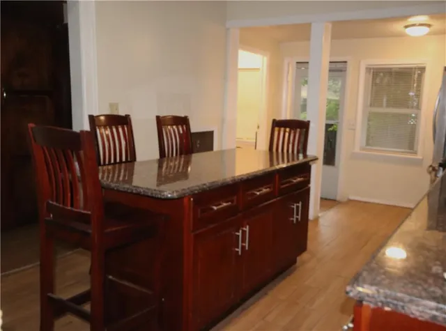 a white toilet sitting next to a bathroom sink and vanity