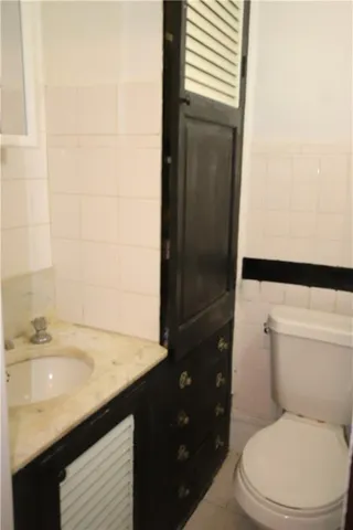 a room with water heater and wooden racks