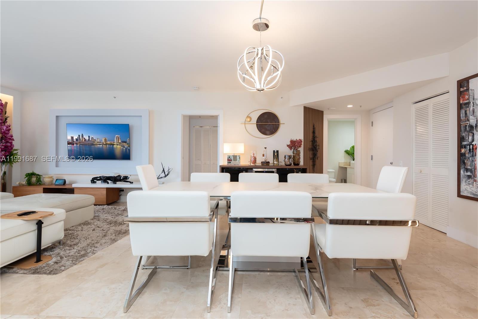 701 Brickell Key Boulevard, Unit 1912 Miami, FL 33131 - Photo 12 of 67 a living room with furniture and a clock