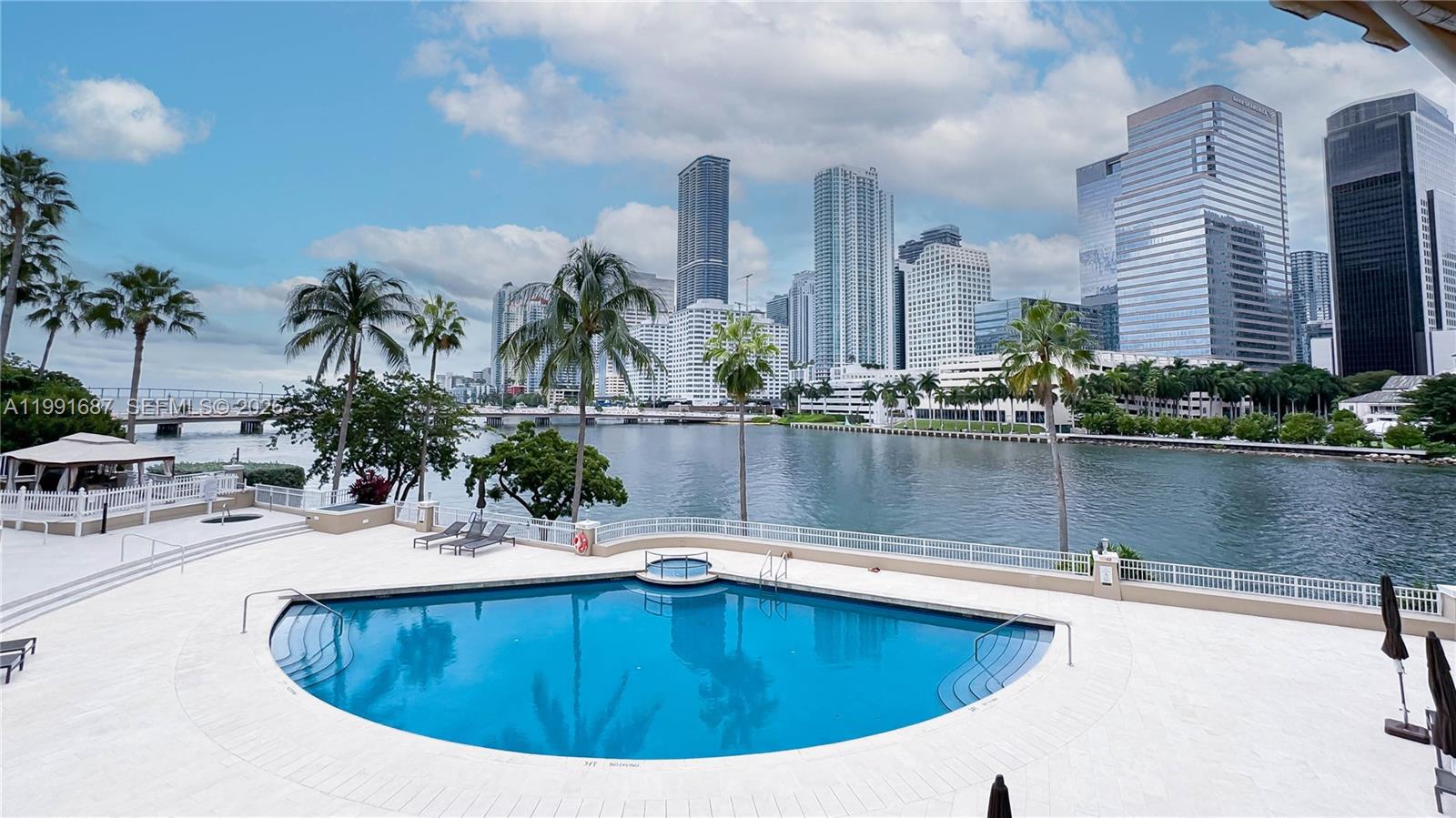 701 Brickell Key Boulevard, Unit 1912 Miami, FL 33131 - Photo 67 of 67 a view of swimming pool with outdoor seating and plants