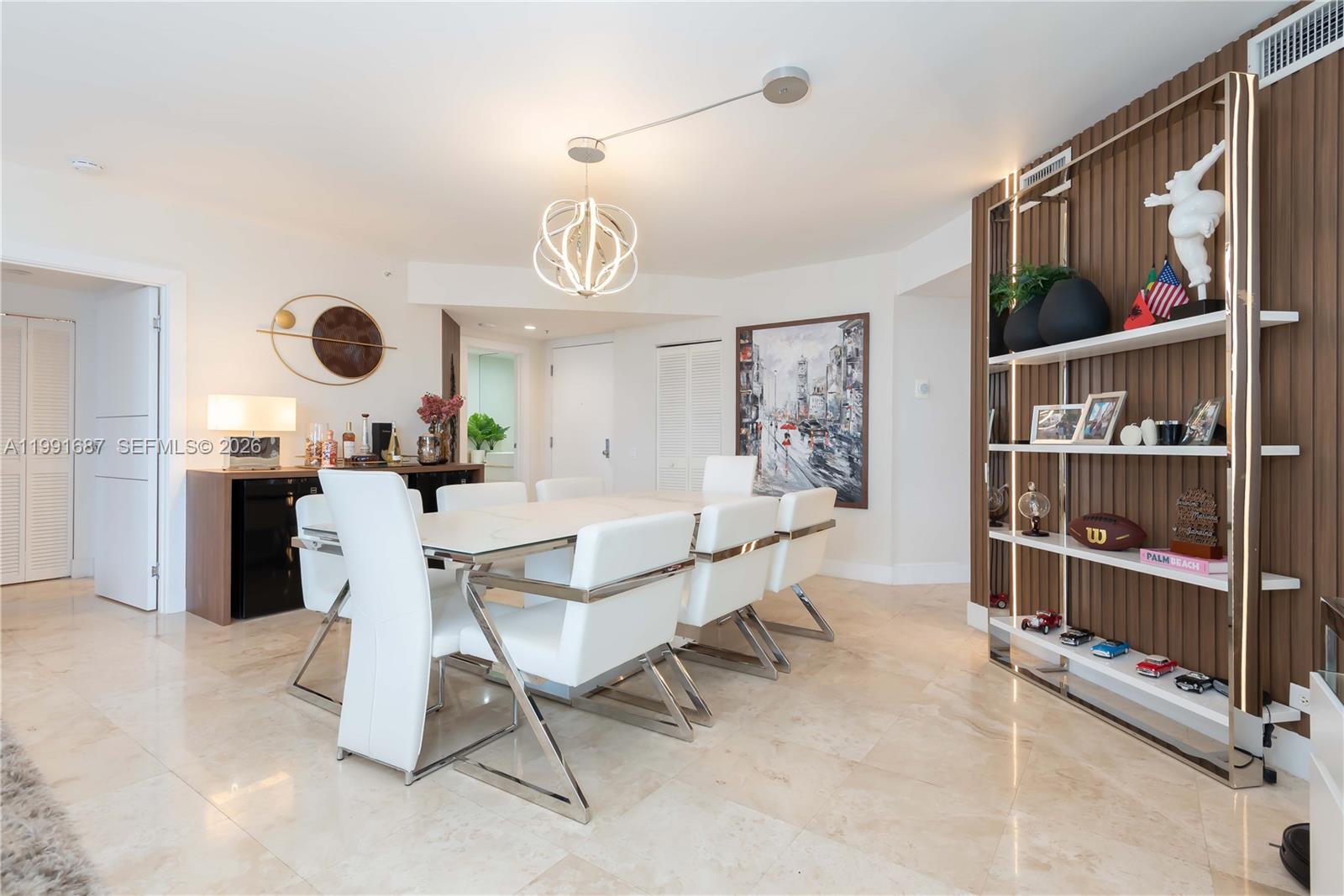 701 Brickell Key Boulevard, Unit 1912 Miami, FL 33131 - Photo 8 of 67 a view of a dining room and kitchen