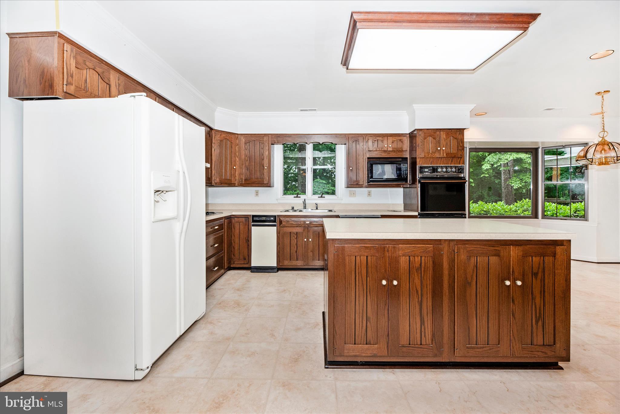 2221 Gold Mine Road Brookeville, MD 20833 - Photo 14 of 60 a kitchen with stainless steel appliances a refrigerator and a stove