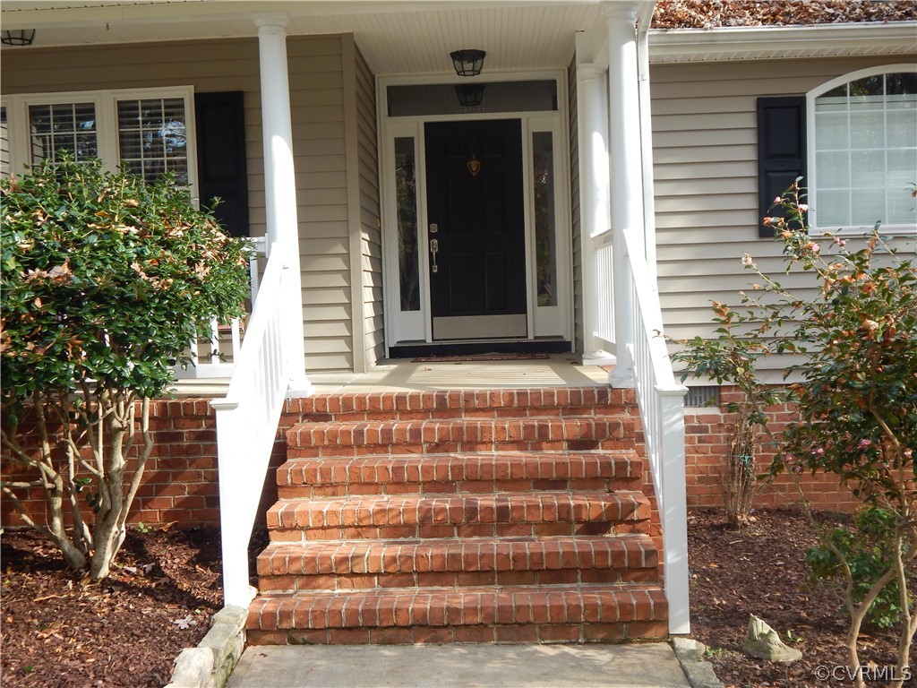 1389 Palmore Road Powhatan, VA 23139 - Photo 6 of 38 Front Porch with cement flooring.