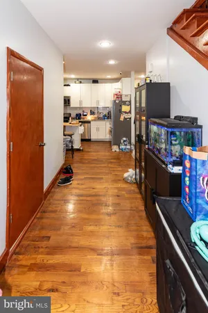 a view of a room with wooden floor and closet
