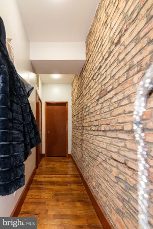 a bathroom with a sink a toilet and shower curtain