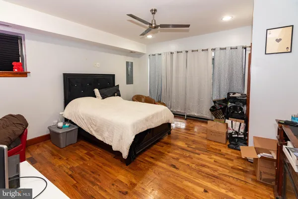 a work room with furniture and a flat screen tv
