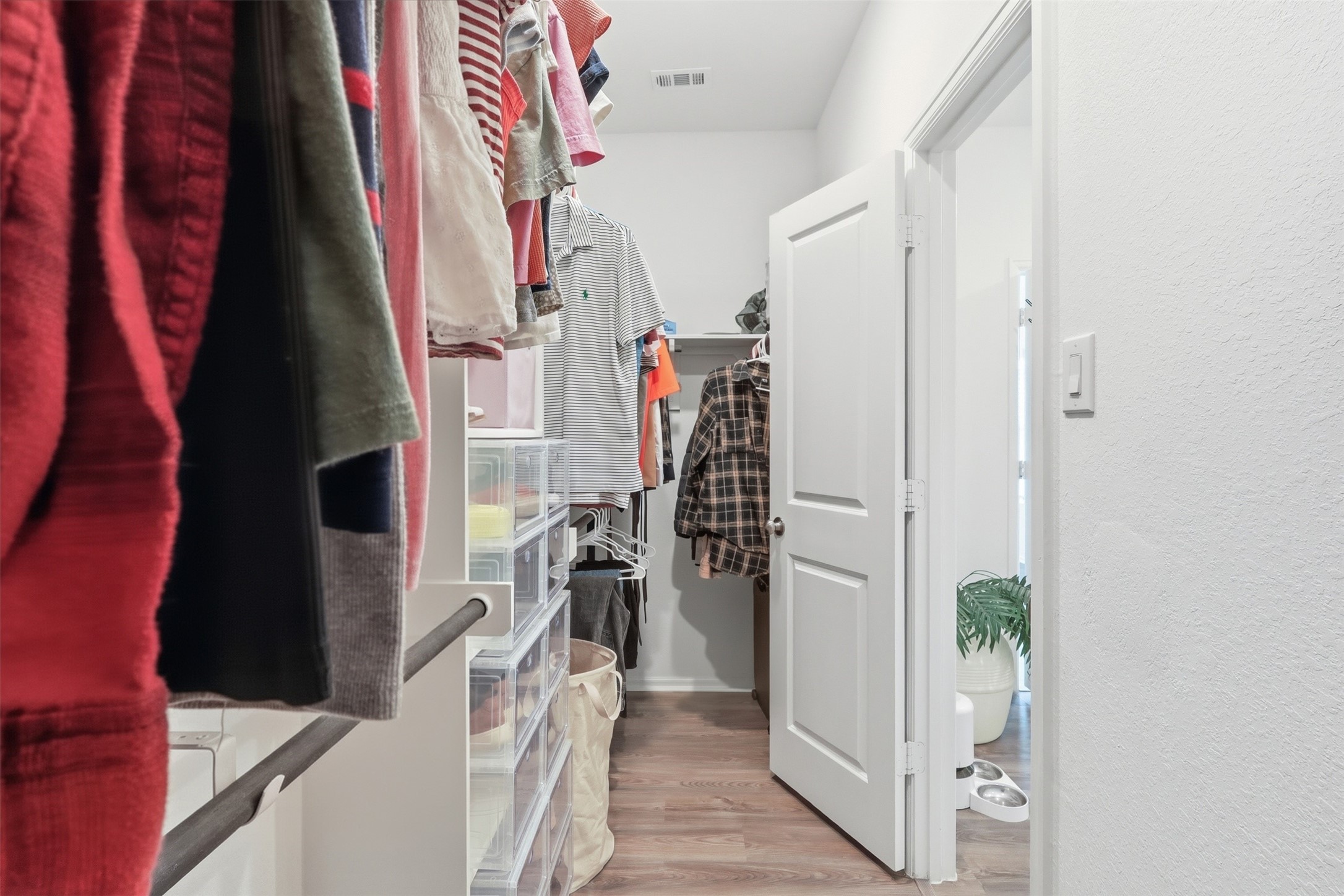 3727 Moss Hl Road Rosenberg, TX 77469 - Photo 22 of 32 The primary en-suite bathroom features a large walk-in closet with hanging rods and built in shelving.