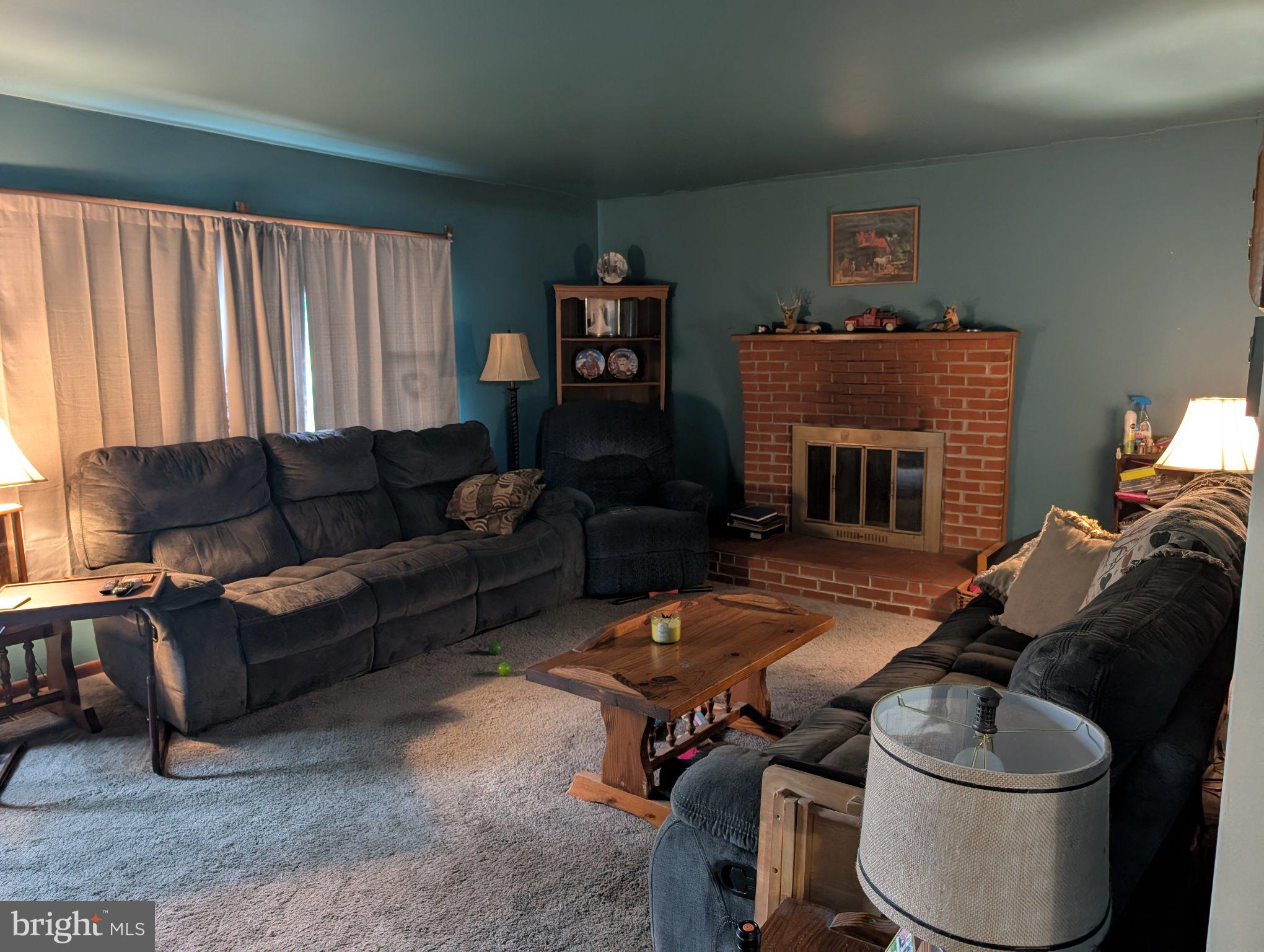 13790 Drapers Mill Road Greensboro, MD 21639 - Photo 12 of 22 Cozy living room with warm ambiance.