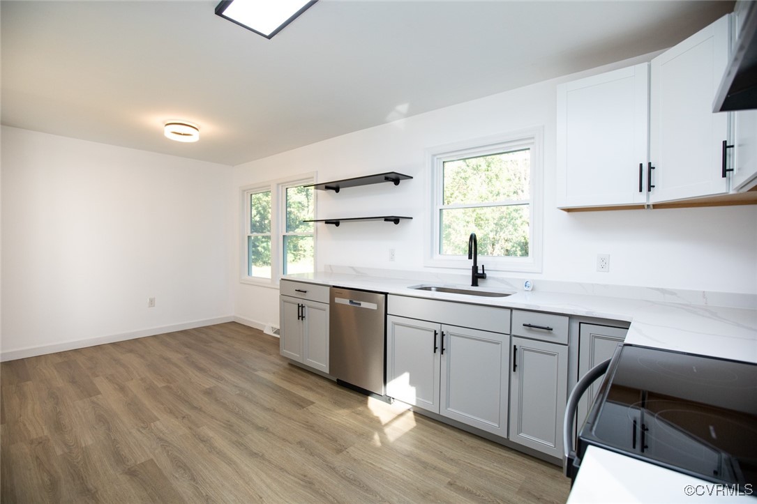 157 Brooklyn Plantation Road Prospect, VA 23960 - Photo 11 of 45 a kitchen with a sink cabinets appliances and a window