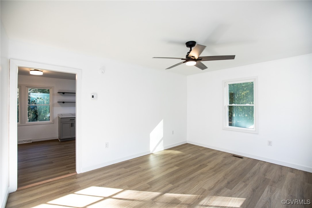 157 Brooklyn Plantation Road Prospect, VA 23960 - Photo 6 of 45 a view of empty room with wooden floor and fan