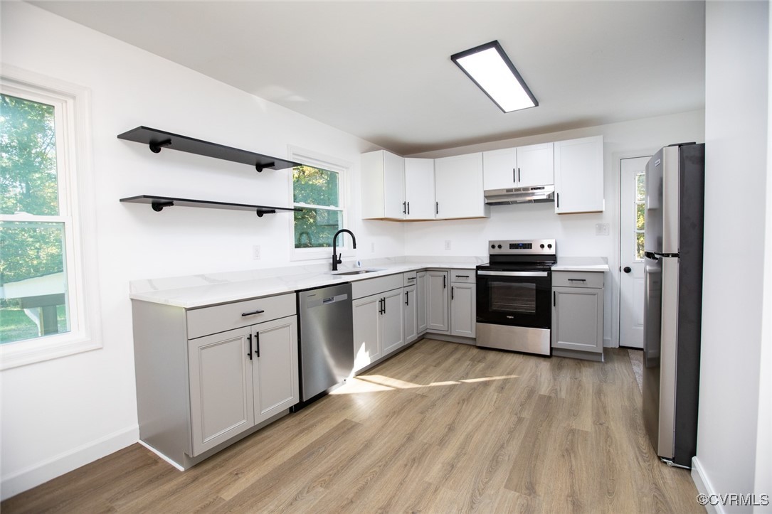 157 Brooklyn Plantation Road Prospect, VA 23960 - Photo 8 of 45 a kitchen with a white cabinets and wooden floor