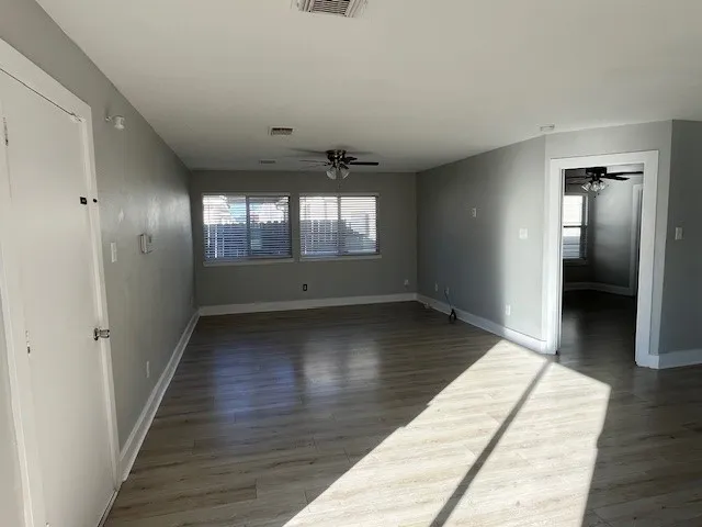 wooden floor in a hall with an entryway