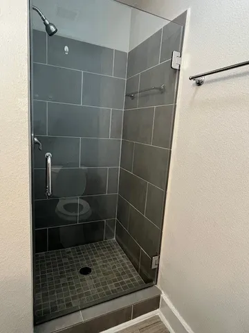 a bathroom with a glass shower