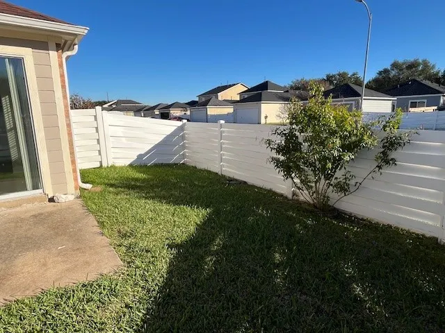 a view of a back yard of the house