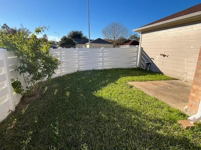 a view of a back yard of the house