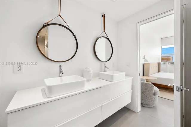 a bathroom with a double vanity sink and a mirror