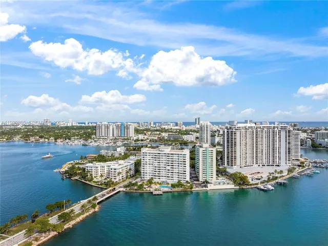 an aerial view of a house with a lake view