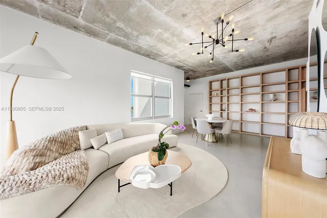 a living room with furniture and white walls