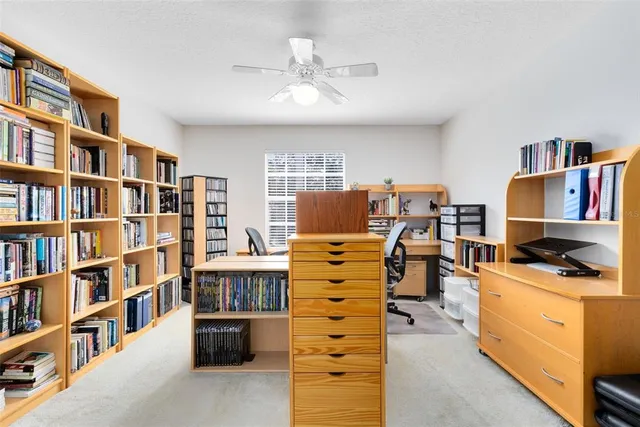 a view of living room and workspace