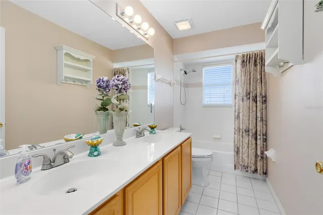 a bathroom with a sink mirror and vanity