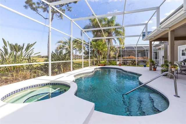 a view of a swimming pool with a patio