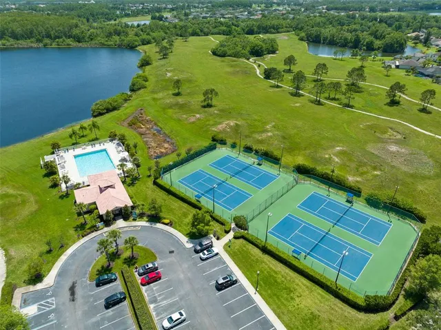 an aerial view of a residential houses with outdoor space
